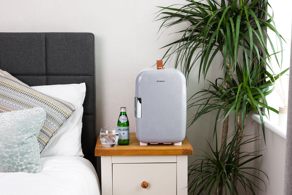 Portable 10L mini fridge, light grey exterior with front handle and side latch