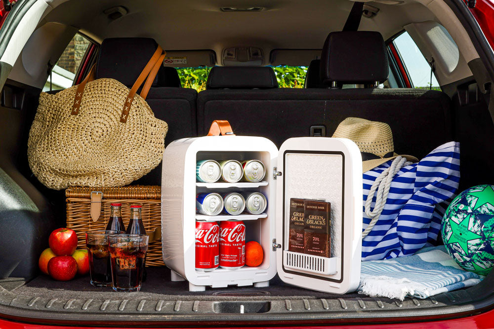 Subcold Pro 10L mini fridge in car trunk, open door with drinks and cans inside