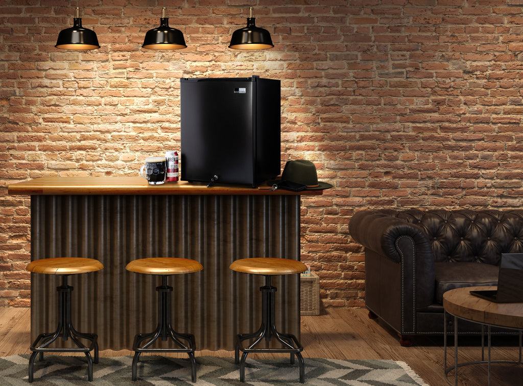 Black mini bar fridge on counter with open door closed