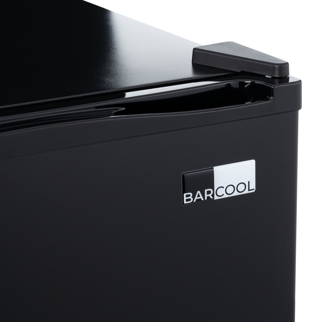 Black mini bar fridge with top handle and BARCOOL logo on front