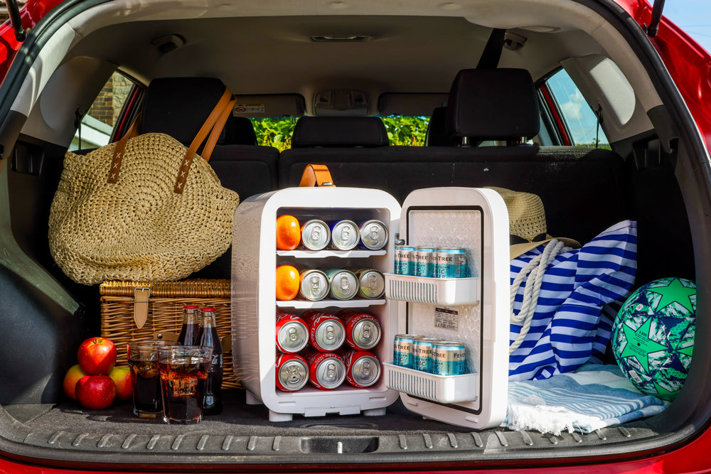 Mini fridge in car trunk with drinks and cans stored in open unit