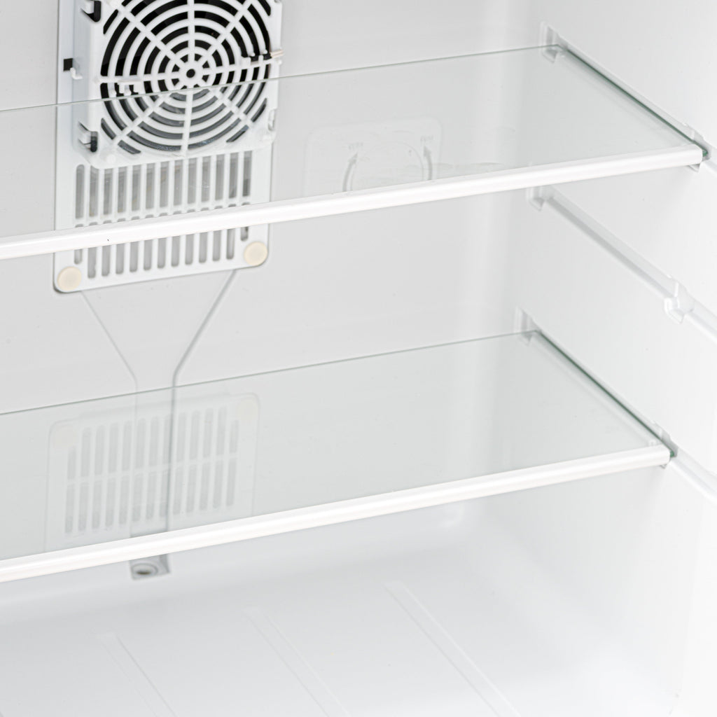 Mini fridge interior with clear shelves and top-mounted fan ventilation