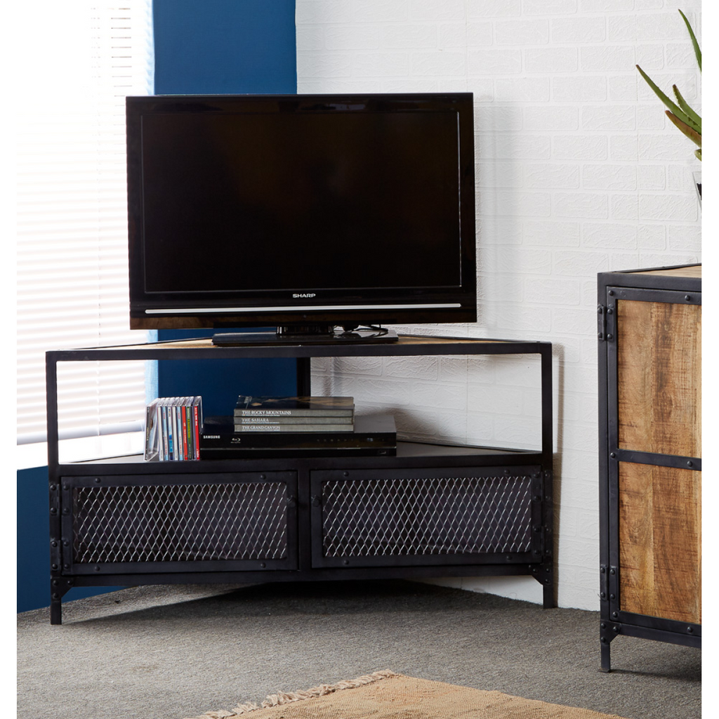 Corner TV stand with open center shelf and two dark mesh cabinet doors for media storage