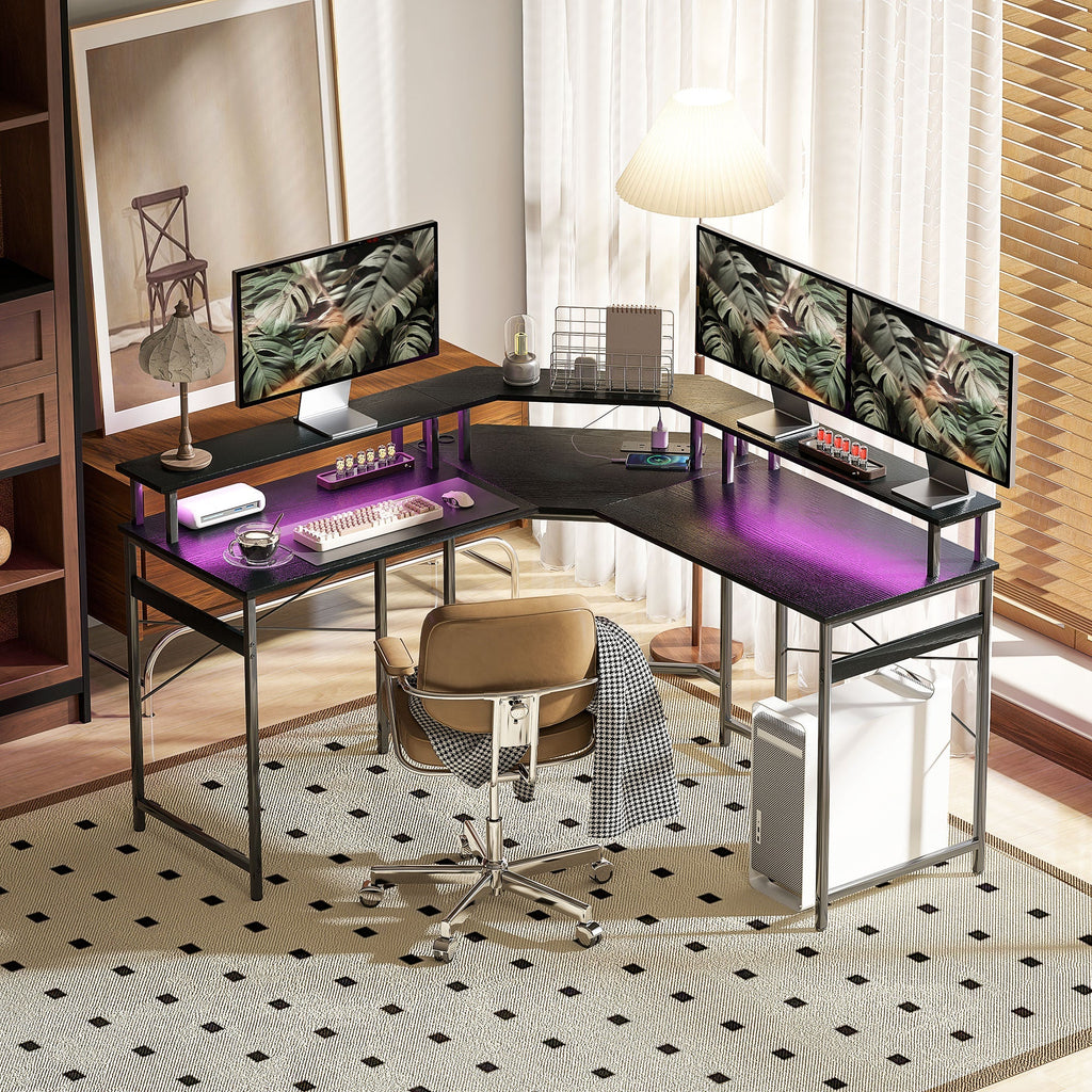 Black L-shaped gaming desk with purple LED glow under the tabletop
