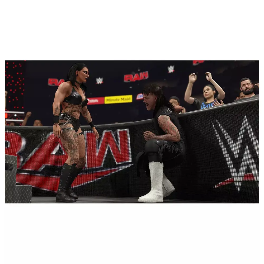 PS5 wrestling video game screen: two wrestlers facing off on arena platform