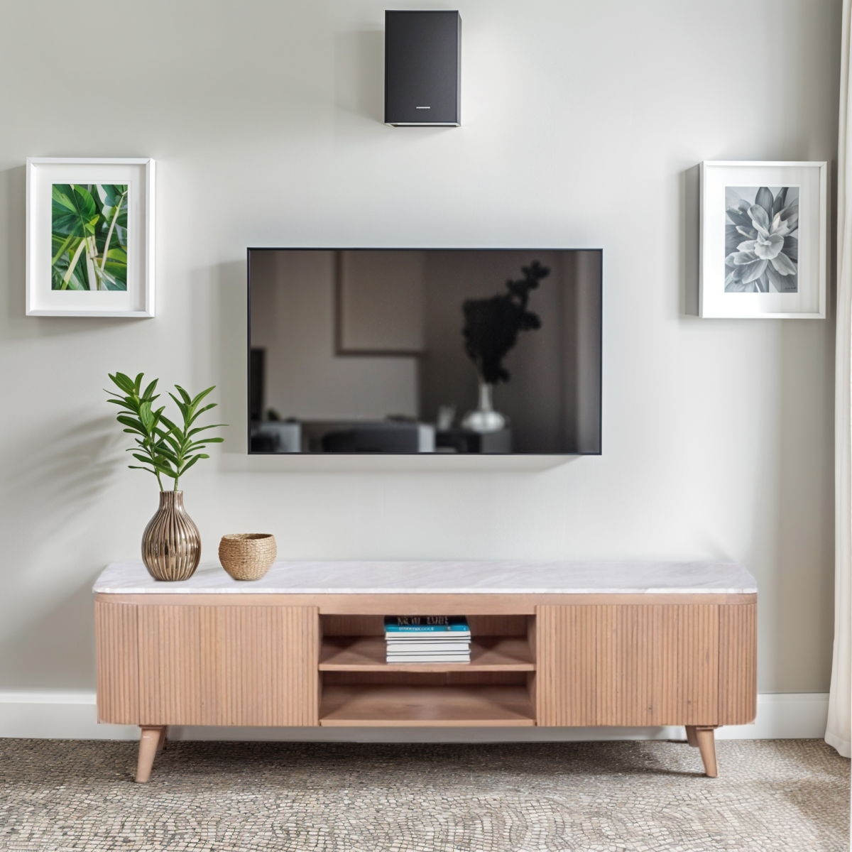 Large TV cabinet with veined marble top, fluted wood doors, and center open shelving
