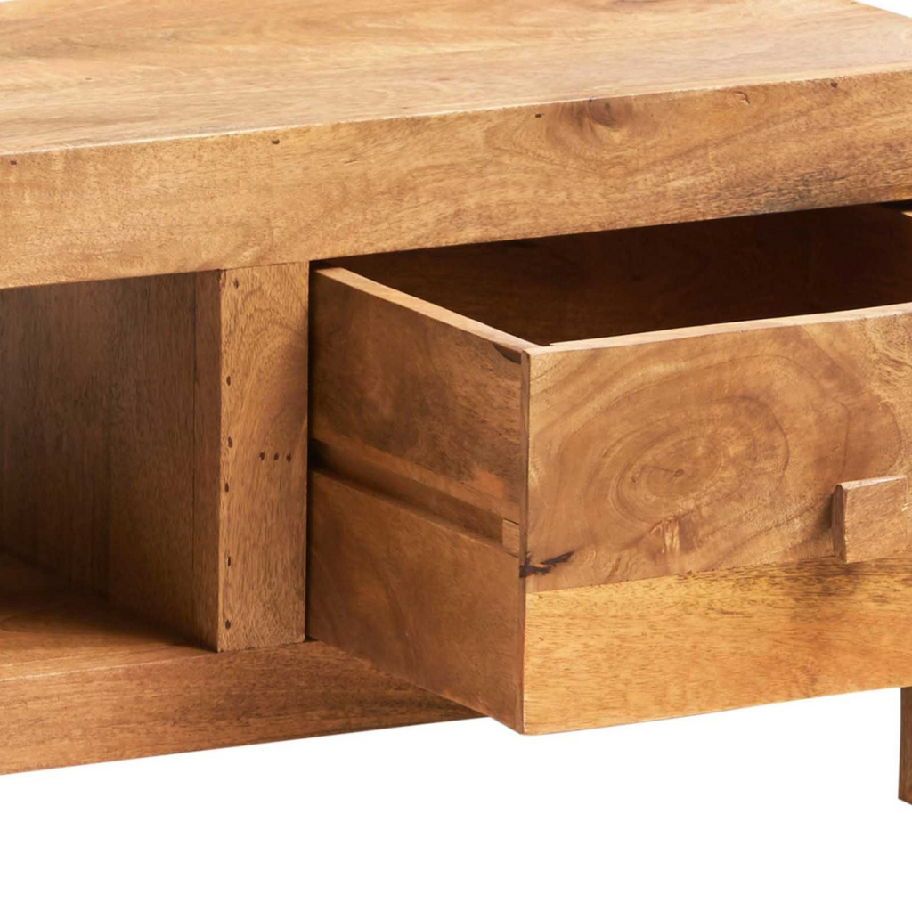 Close-up of mango wood TV cabinet drawer fronts and open shelf inside