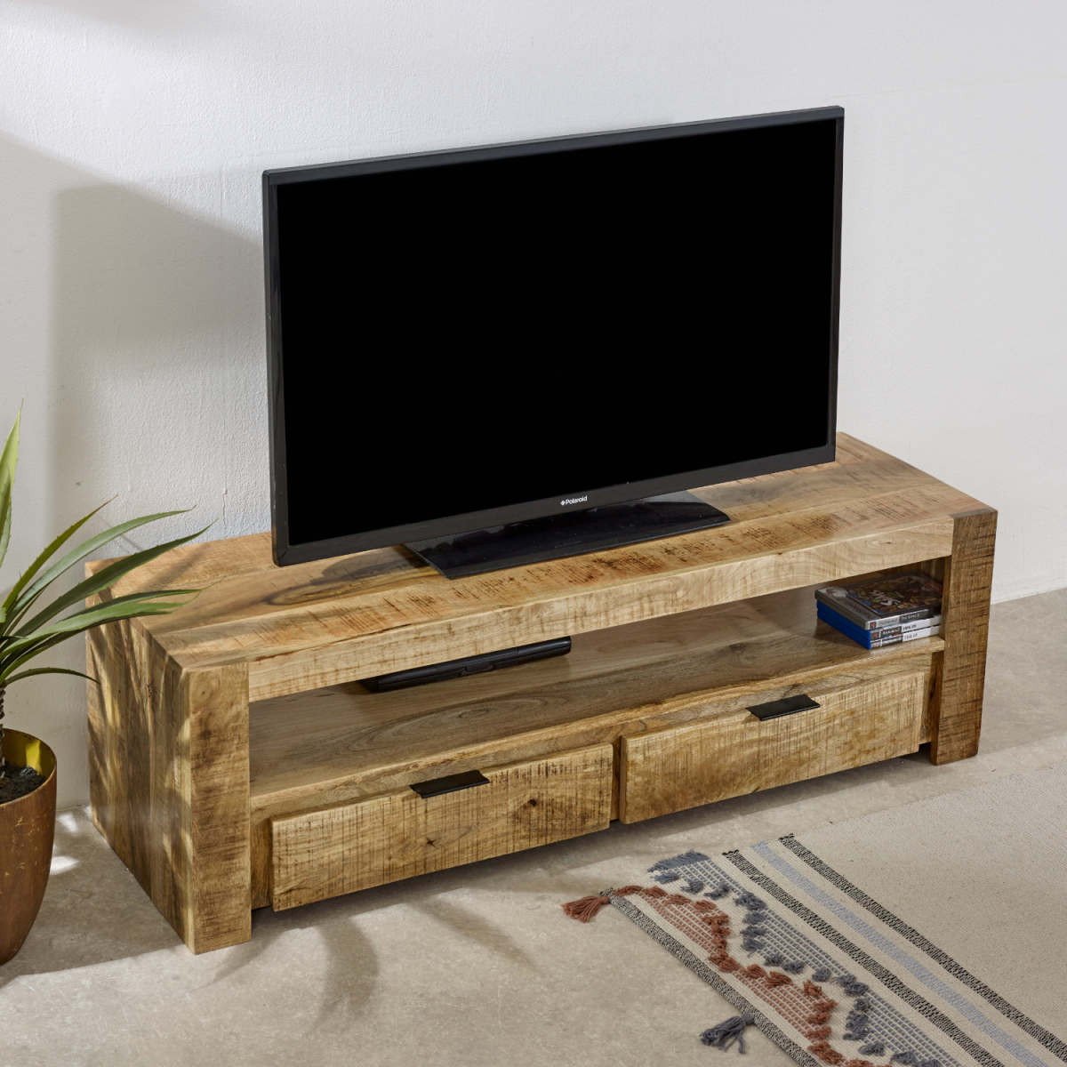 Solid wood TV stand with 2 drawers and open shelf, TV on top, angled view