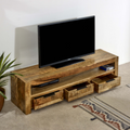 Rustic solid wood TV console with open shelf and two drawer fronts, three-bay design.