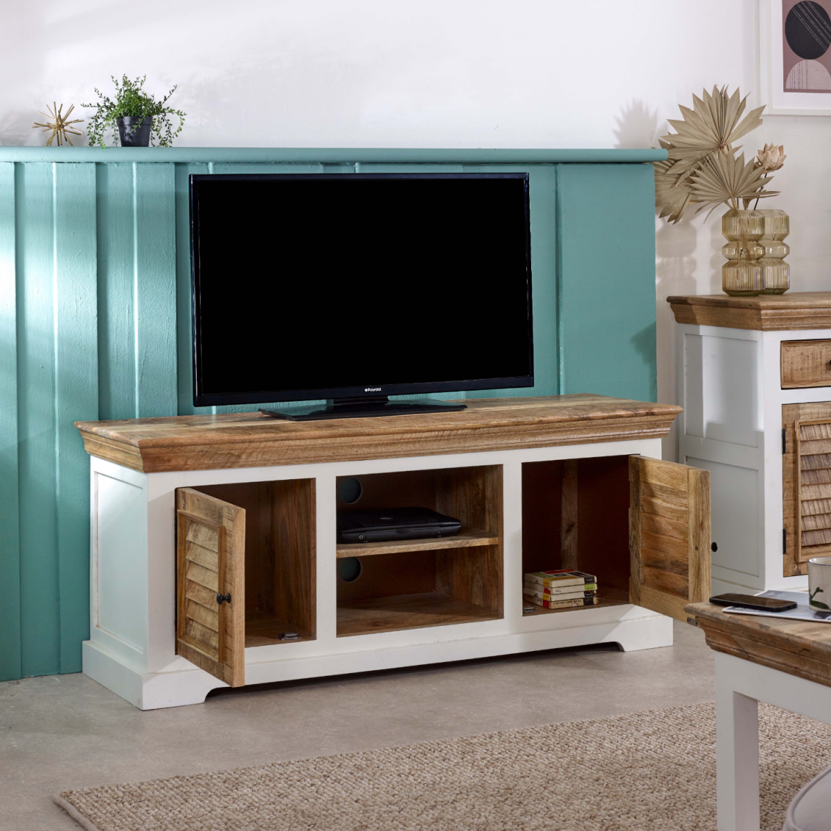 TV cabinet in white and mango wood with open center shelf and shutter-style side doors.