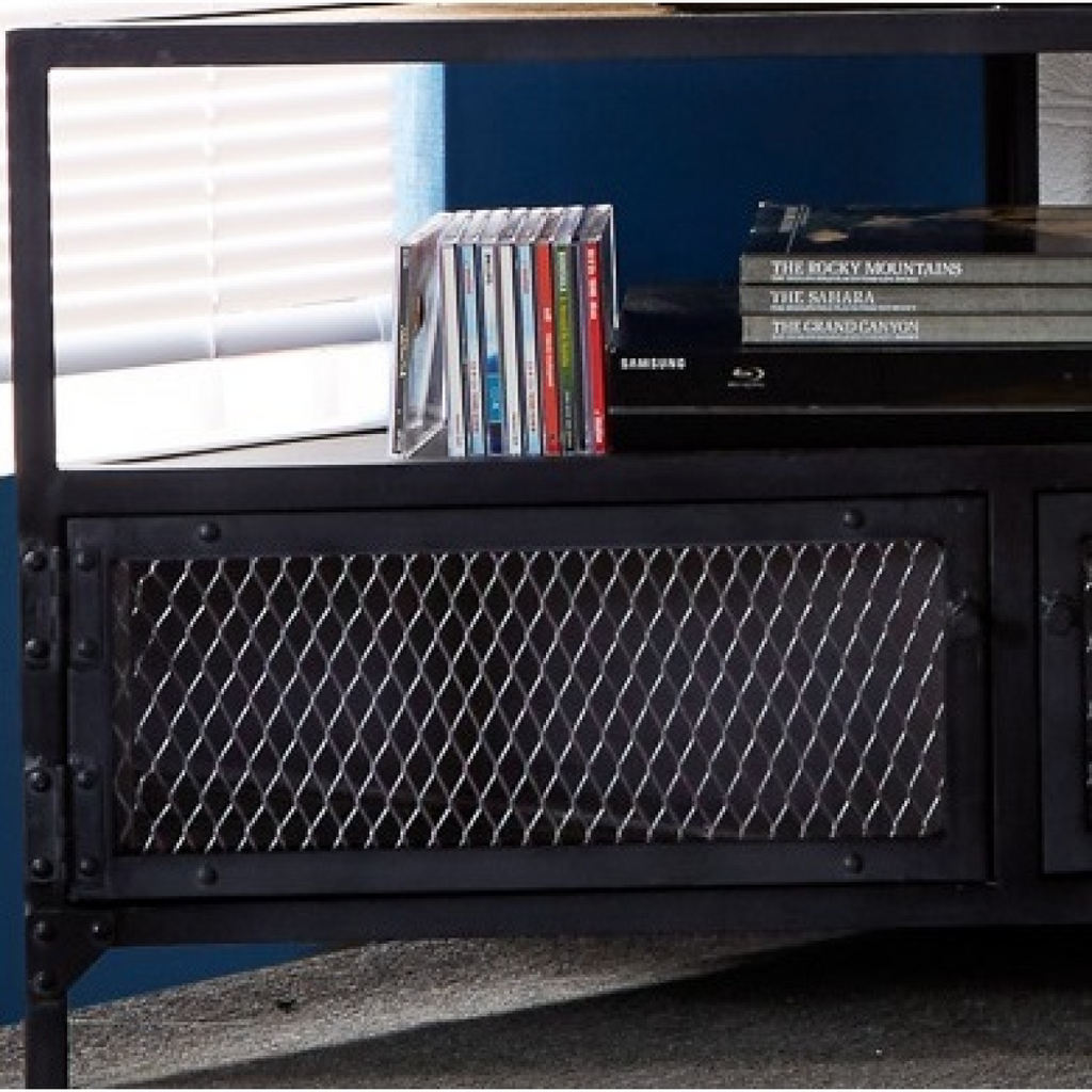Close-up of dark mesh cabinet door on a black TV unit with books on the shelf