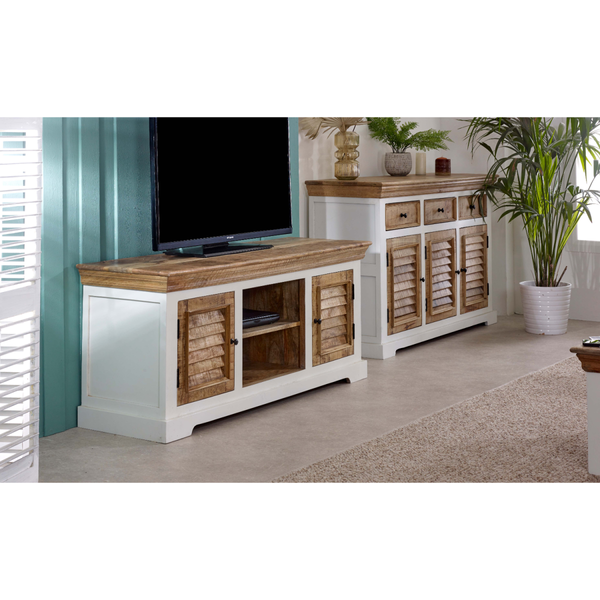 Mango wood TV cabinet with open media bay, two shutter doors, and raised top edge.