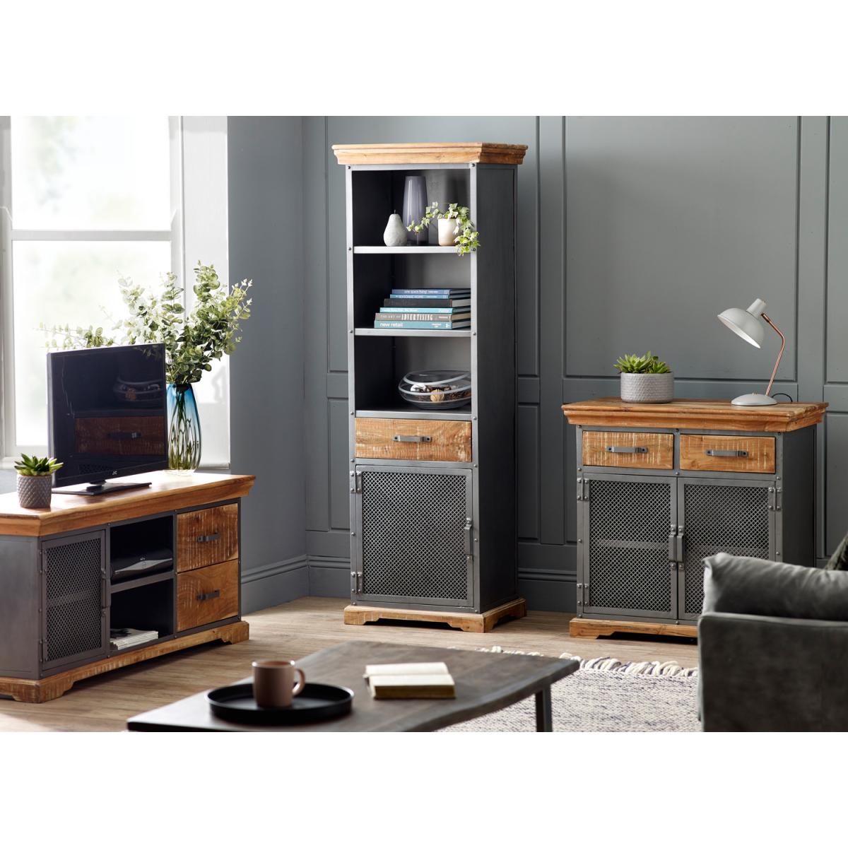 Wood TV media unit with mesh door, open shelves, and two drawer fronts.