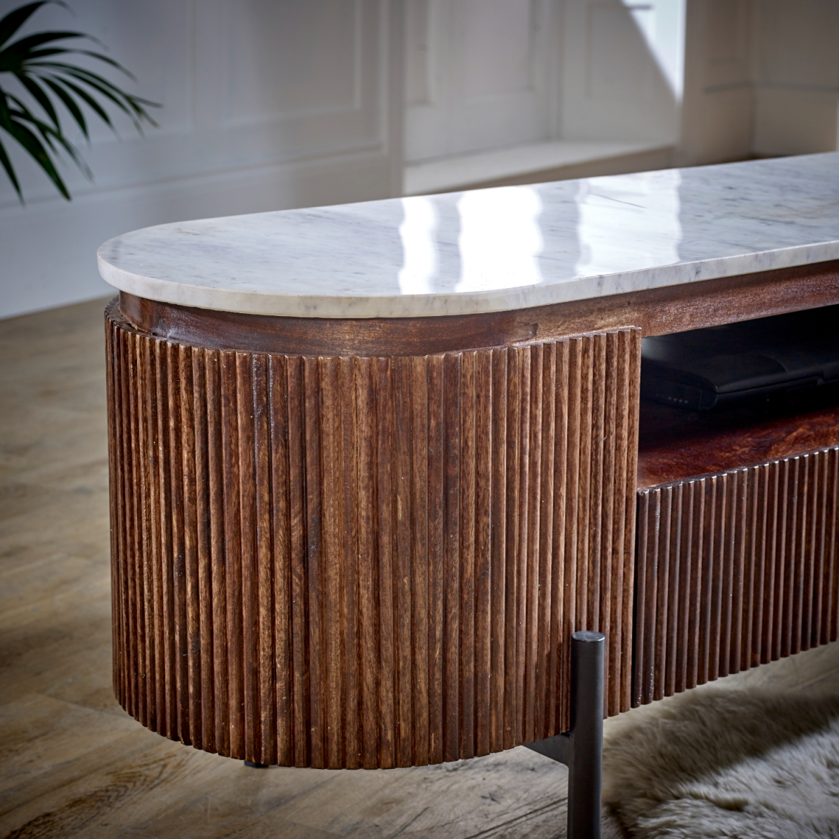 TV stand side view with marble-look top, brown mango wood slats, and black metal leg