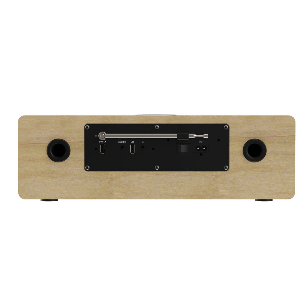 Wooden music system back panel with speaker ports and input connections.