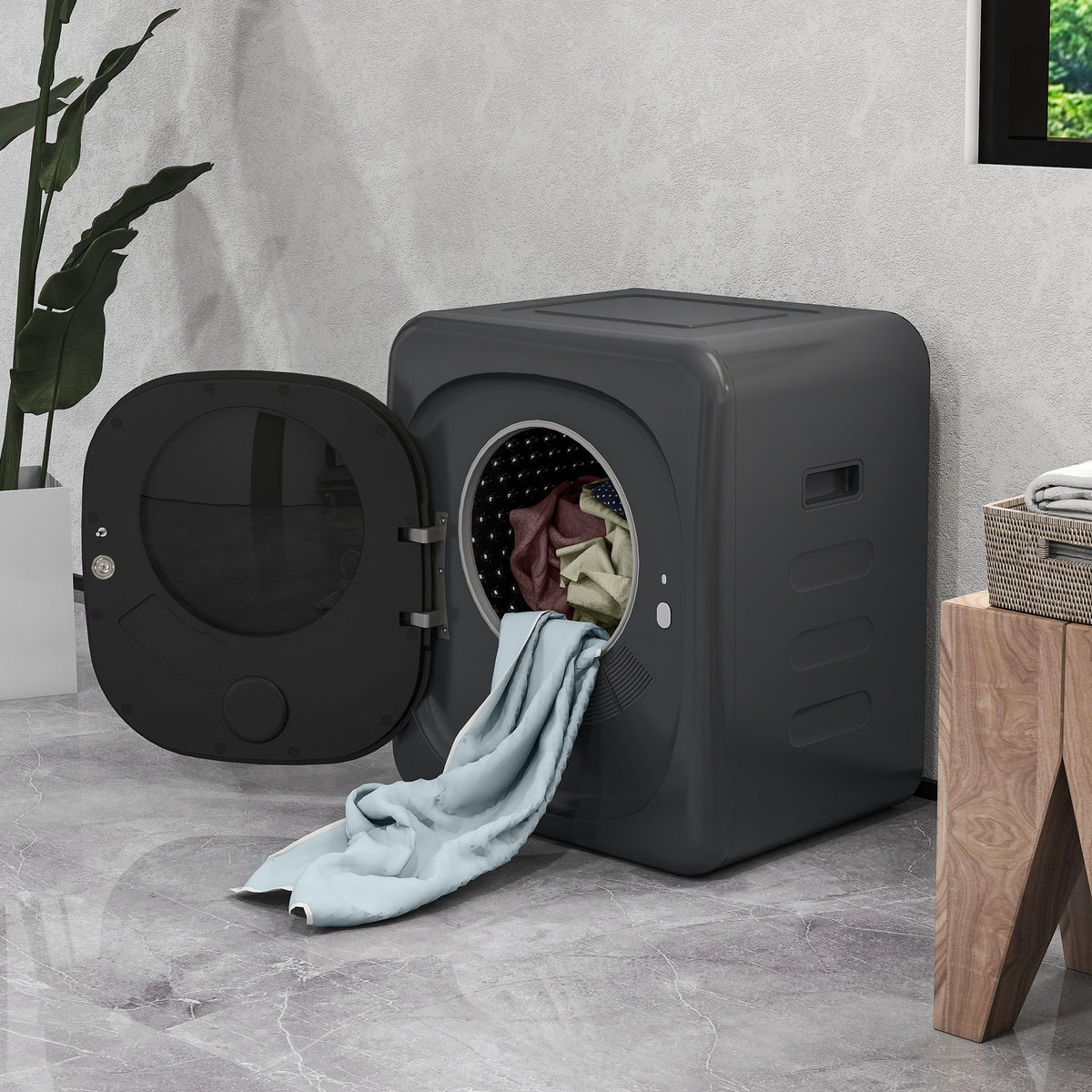 Grey tumble dryer with open round door and folded laundry inside drum