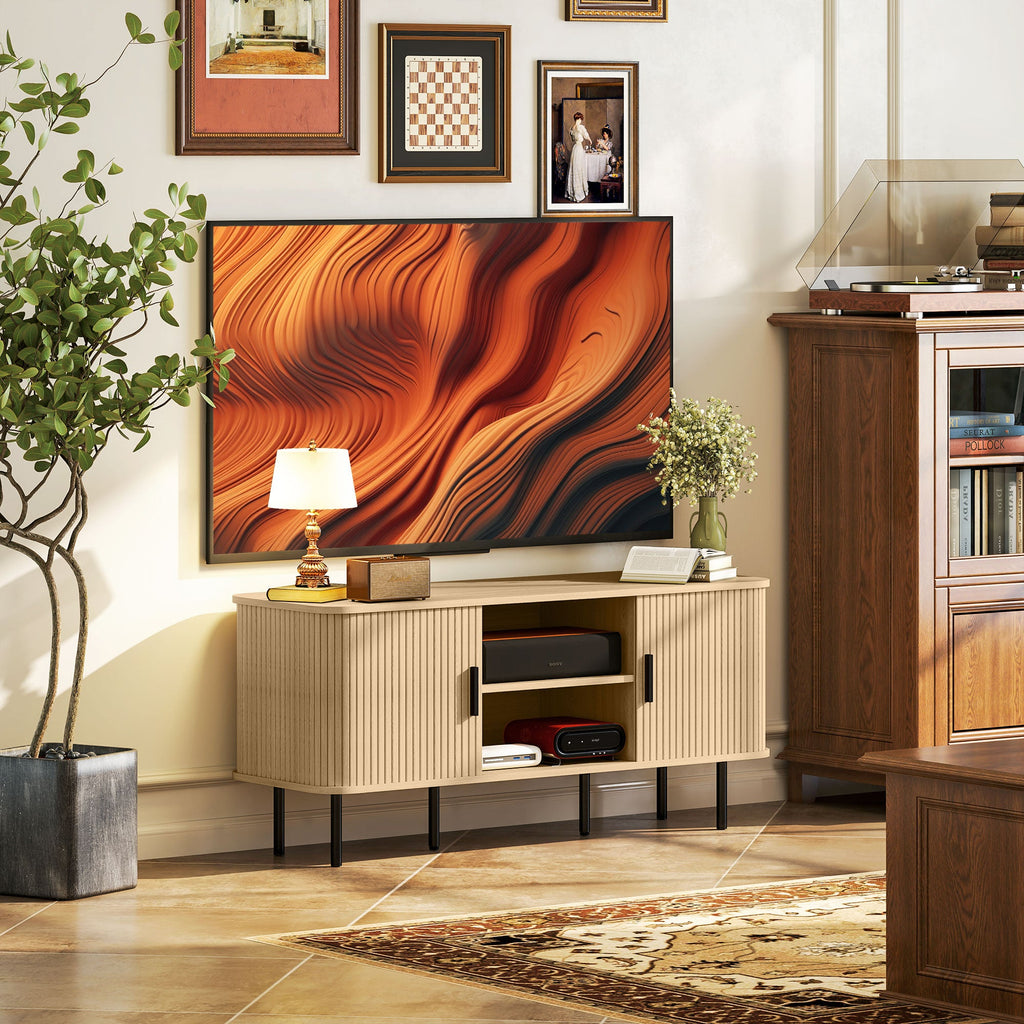 Oak-tone TV cabinet with two-door storage and open center shelf for devices