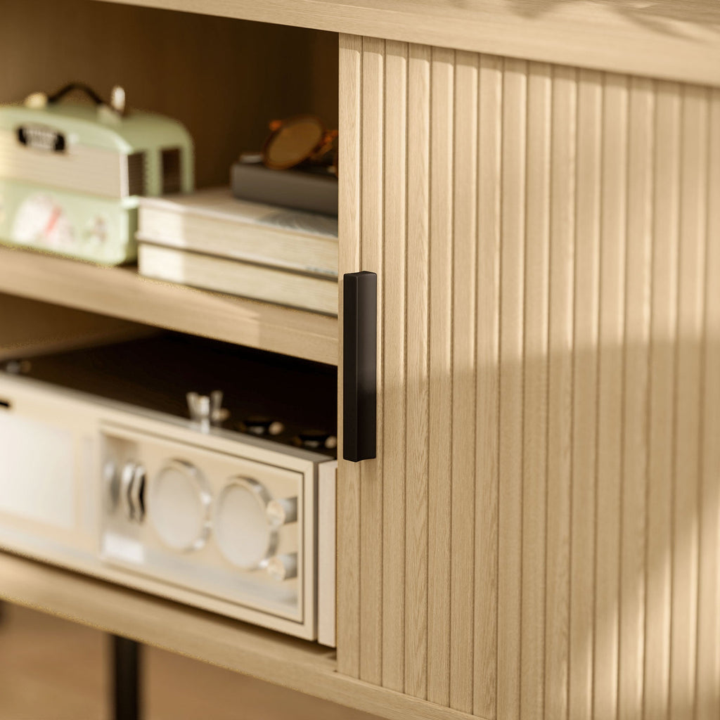 Close-up of oak-tone TV stand door handle and vertical ribbed panel