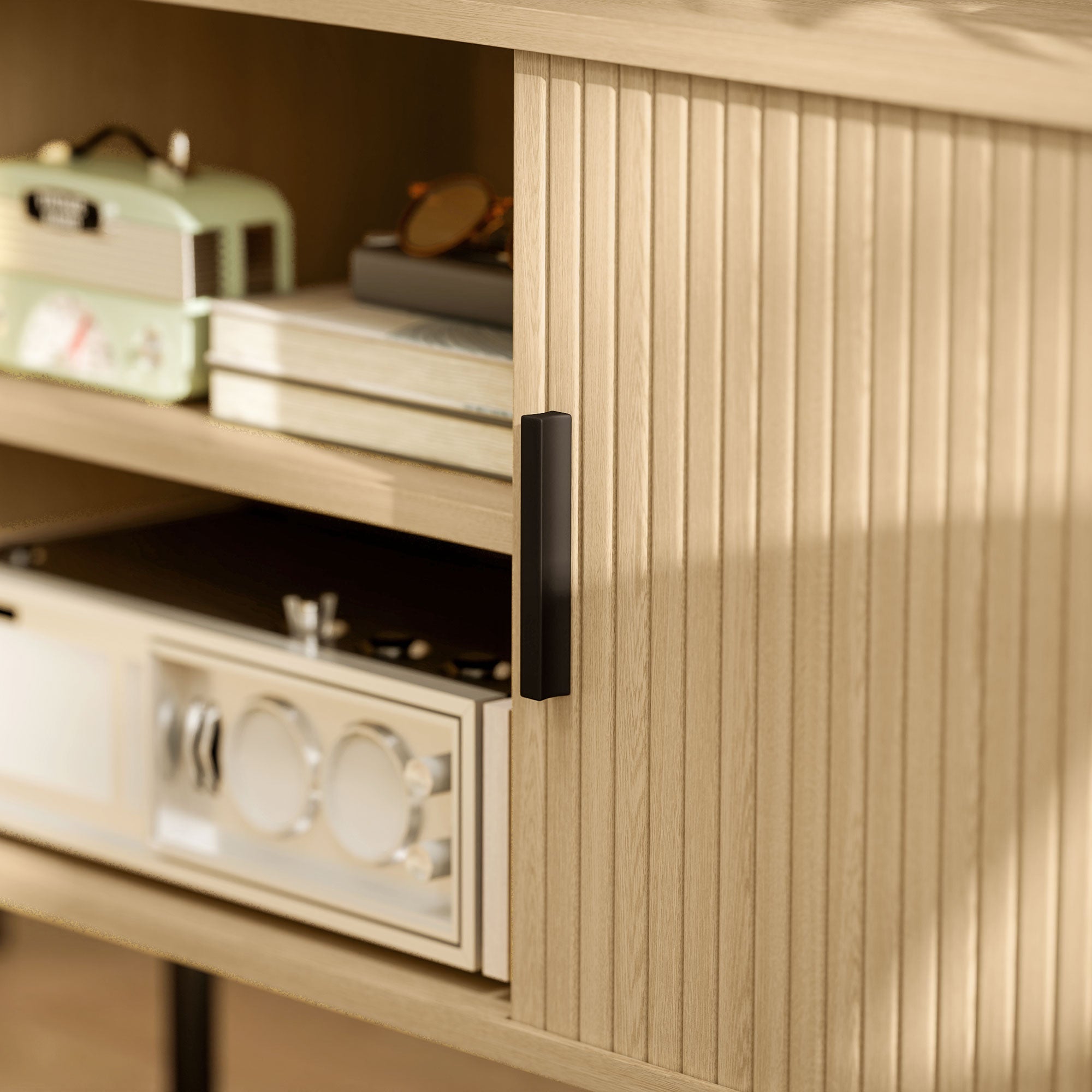 Close-up of oak-tone TV stand door handle and vertical ribbed panel