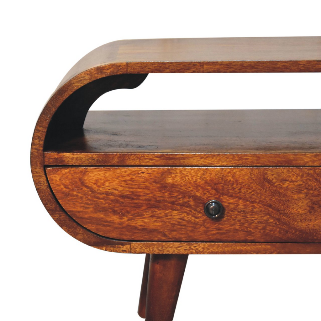 Close-up of chestnut wood round TV stand drawer with knob and curved carved apron