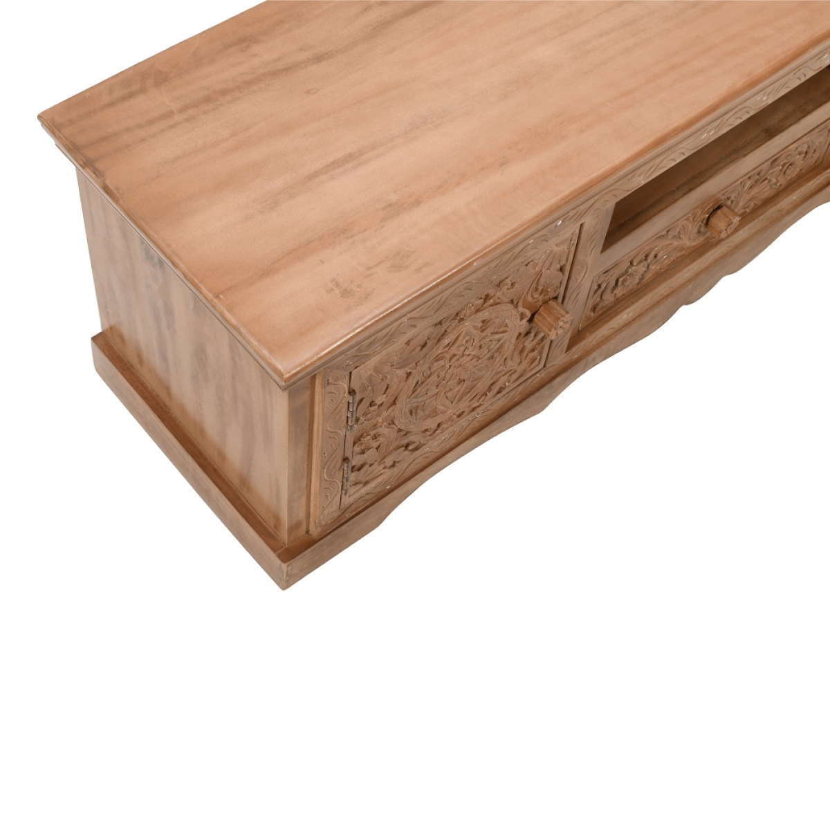 Mango wood TV cabinet close-up with carved drawer front and smooth angled top.