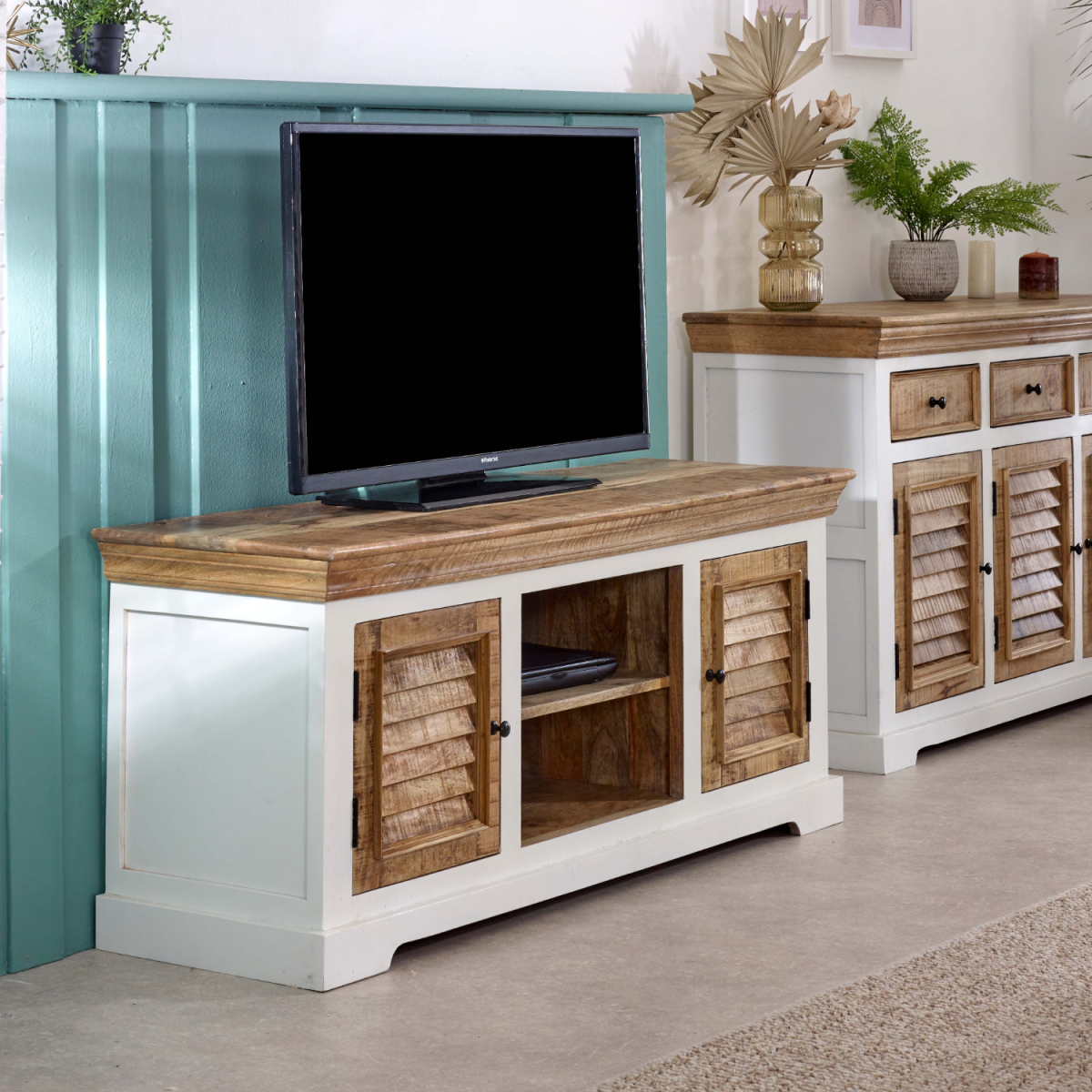 White and mango wood TV console with open shelf, two doors with shutter details, and base.