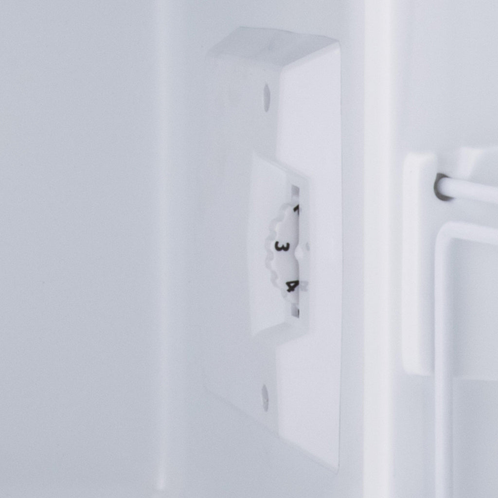 White mini fridge door side panel with built-in power outlet