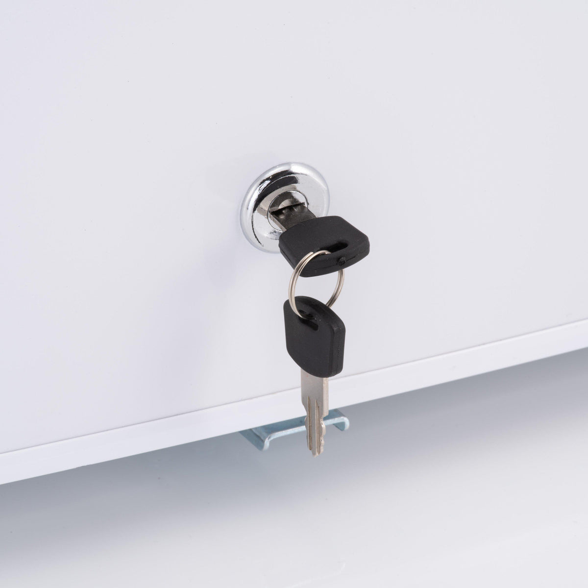 Mini fridge door lock with black keys on white exterior