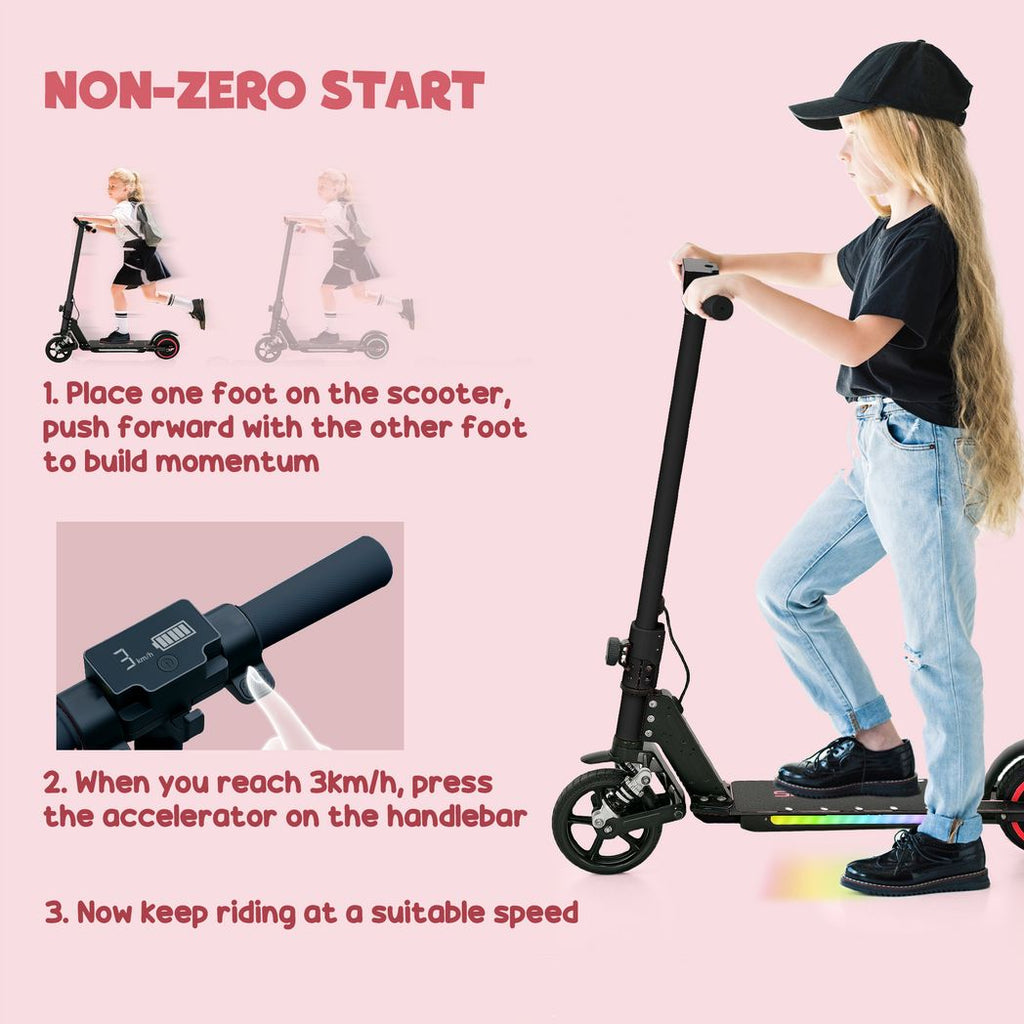 Folding electric scooter with black frame, rider standing beside the handlebar