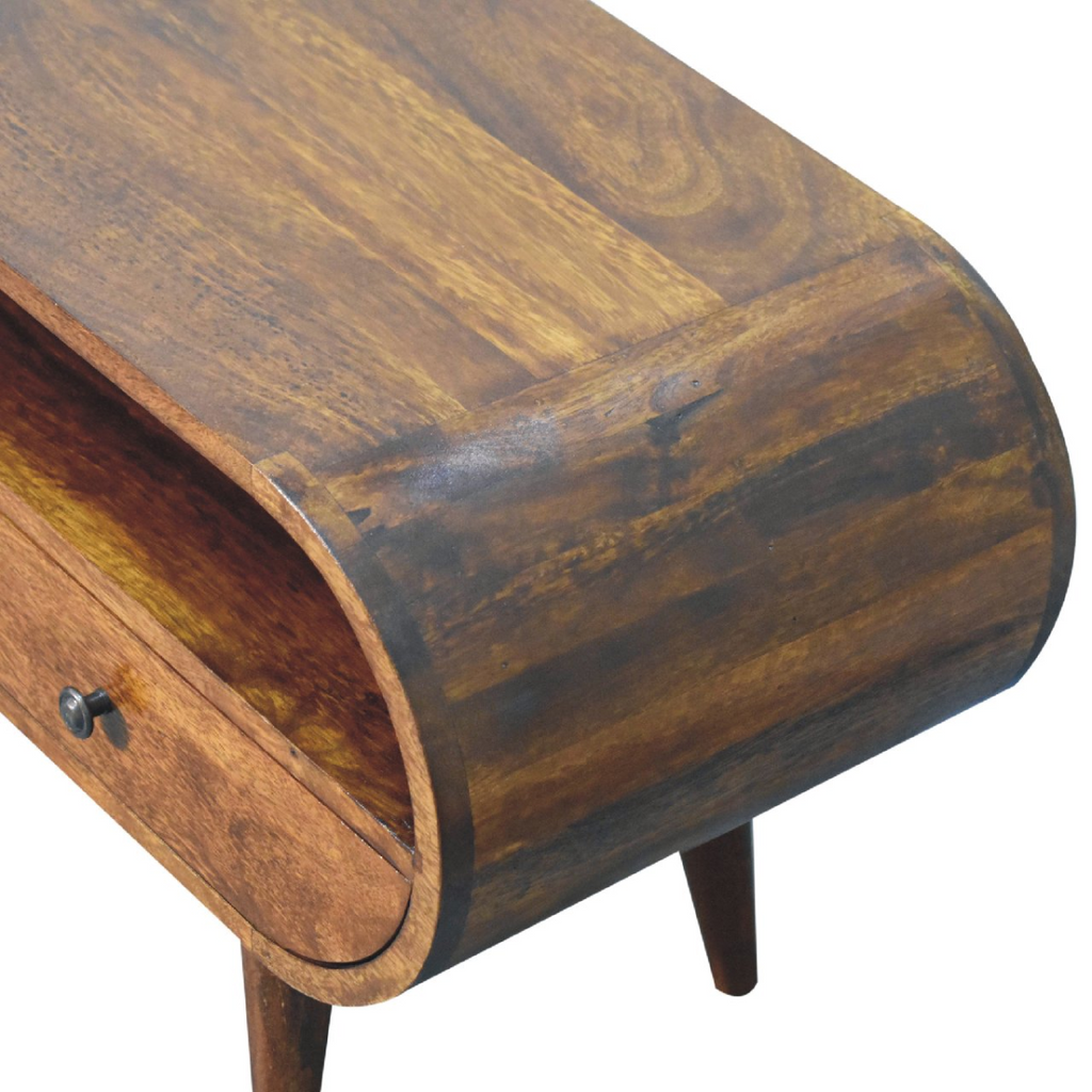 Side view detail of chestnut wood circular TV stand with carved round corner and legs