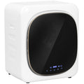 White compact front-load tumble dryer with black glass door and built-in control panel