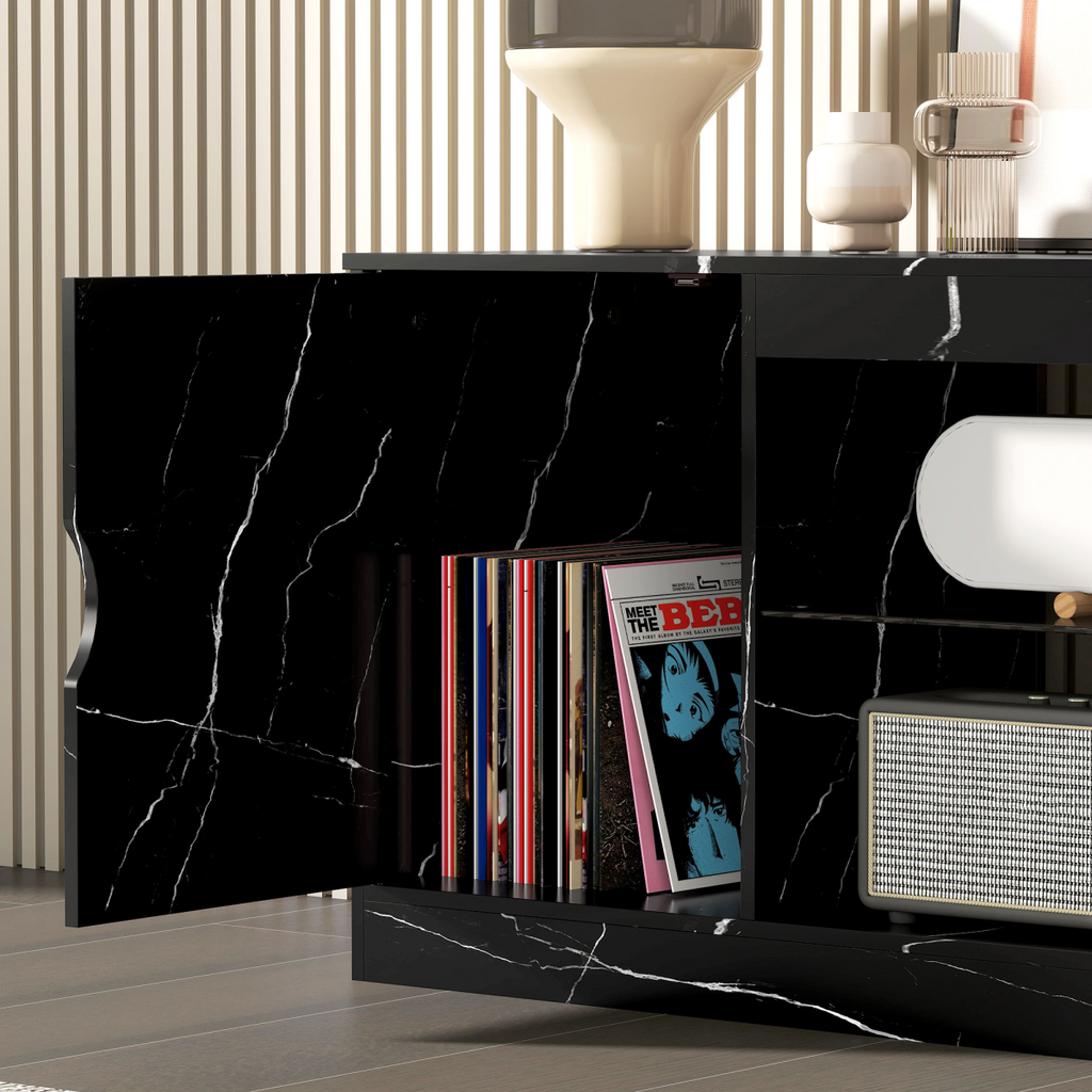 Black marble-effect TV stand side opening with glass shelf for media and accessories.