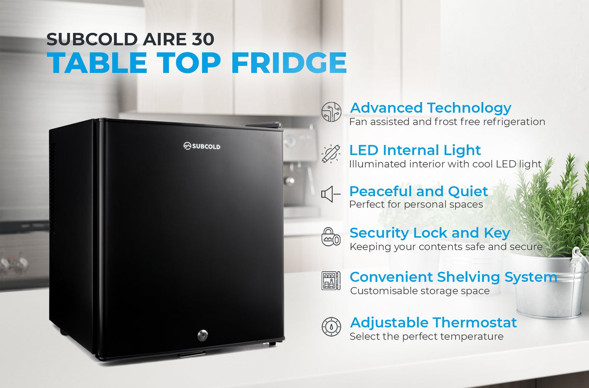 Black Subcold Aire30 tabletop mini fridge front view with top handle
