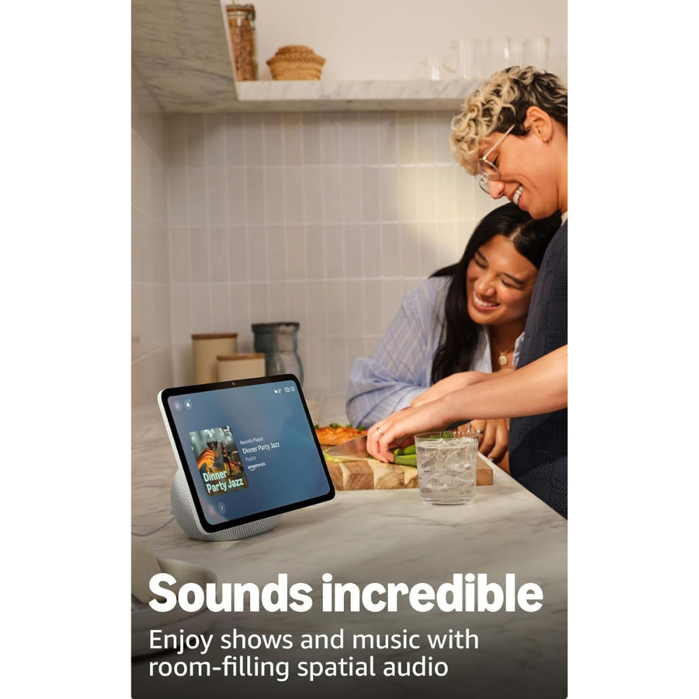 Smart display speaker with touchscreen on desk, used by people in kitchen
