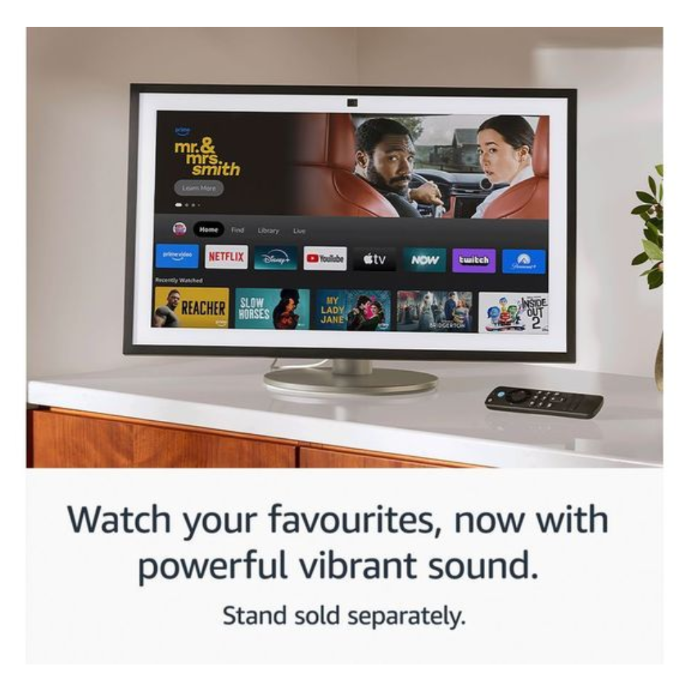Smart display with streaming thumbnails and black remote on countertop