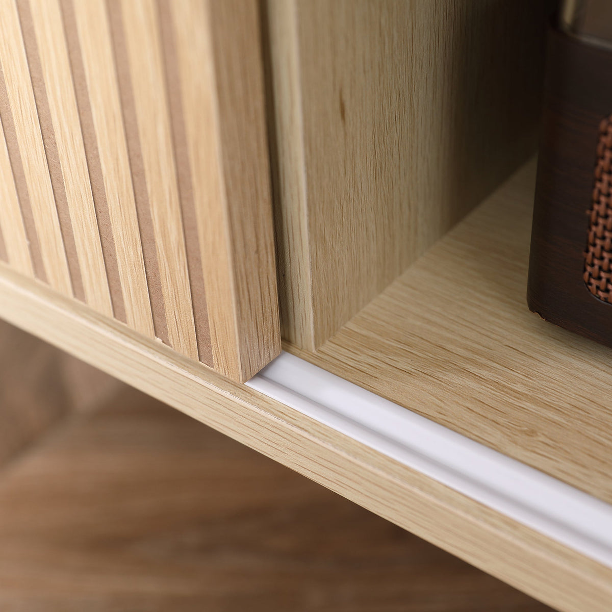 Interior compartment of a natural wood TV stand cabinet with smooth panel walls