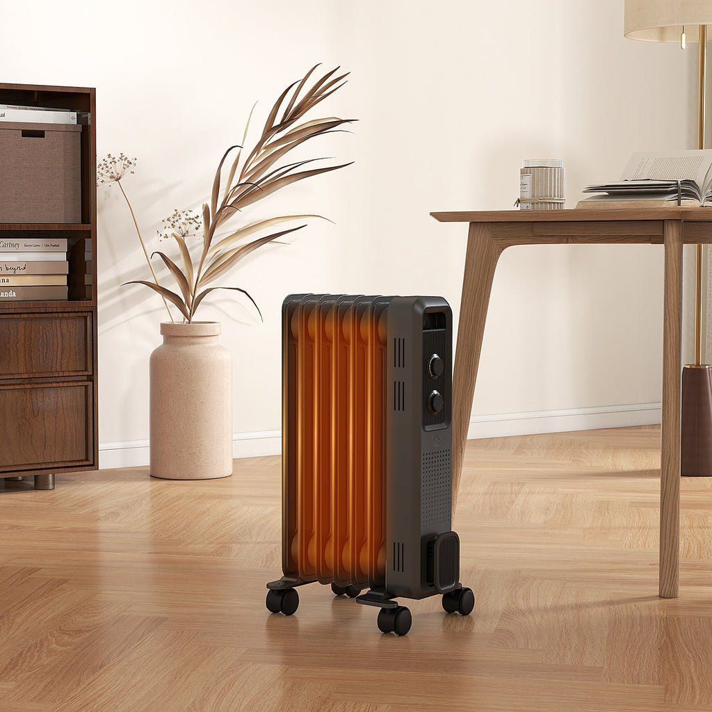 Grey oil-filled radiator heater with 7 fins and caster wheels, shown in a standing side view