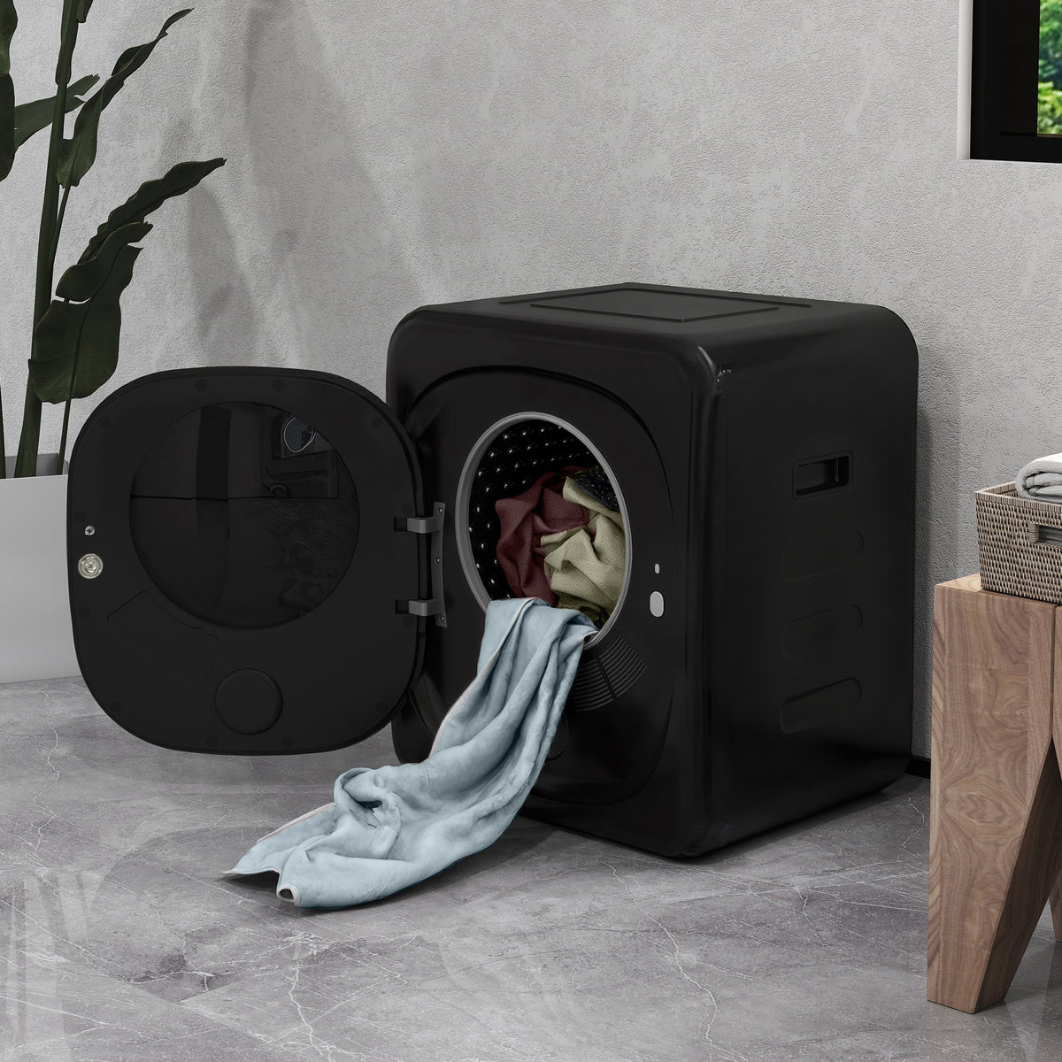 Black front-load tumble dryer with door open and clothes inside the drum