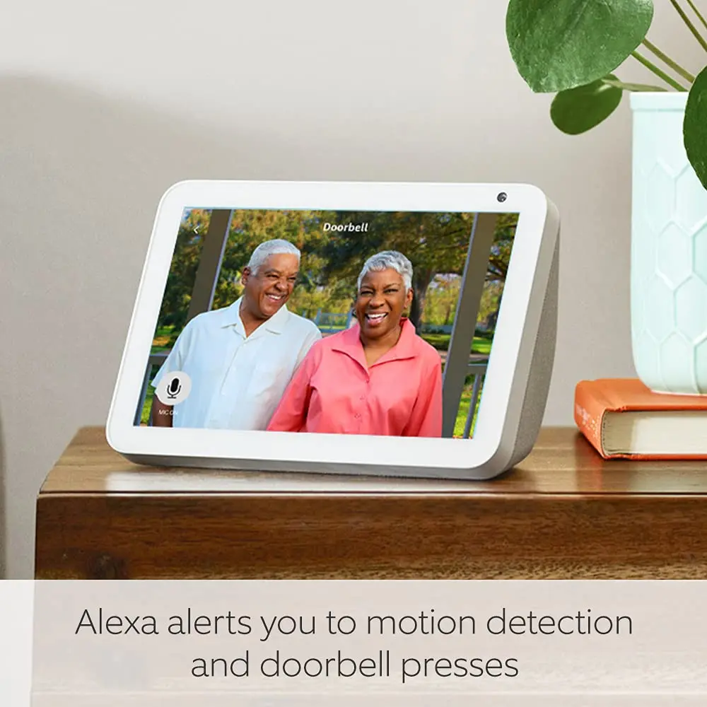 Smart display showing a doorbell video message with two people on screen