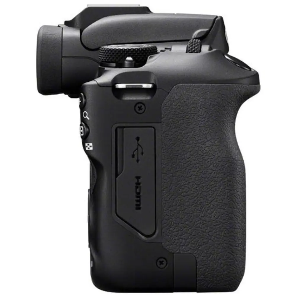 Black digital camera side view with textured grip and control area