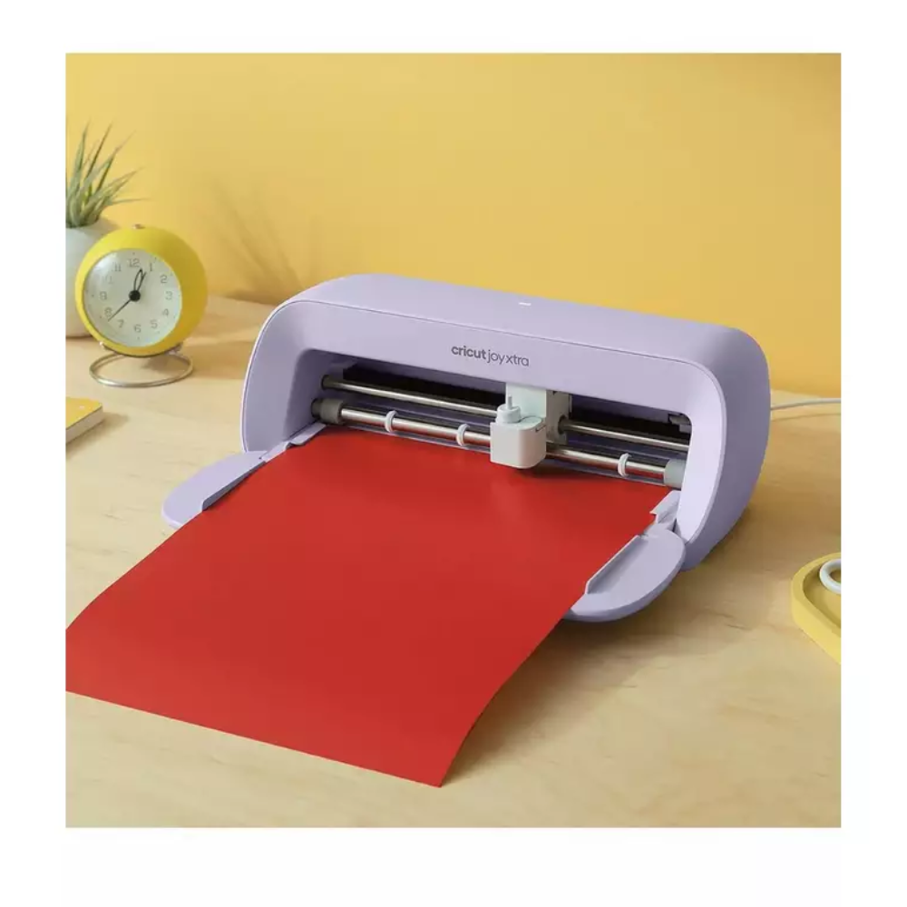 Lavender craft cutting machine with vinyl sheet loaded on the base