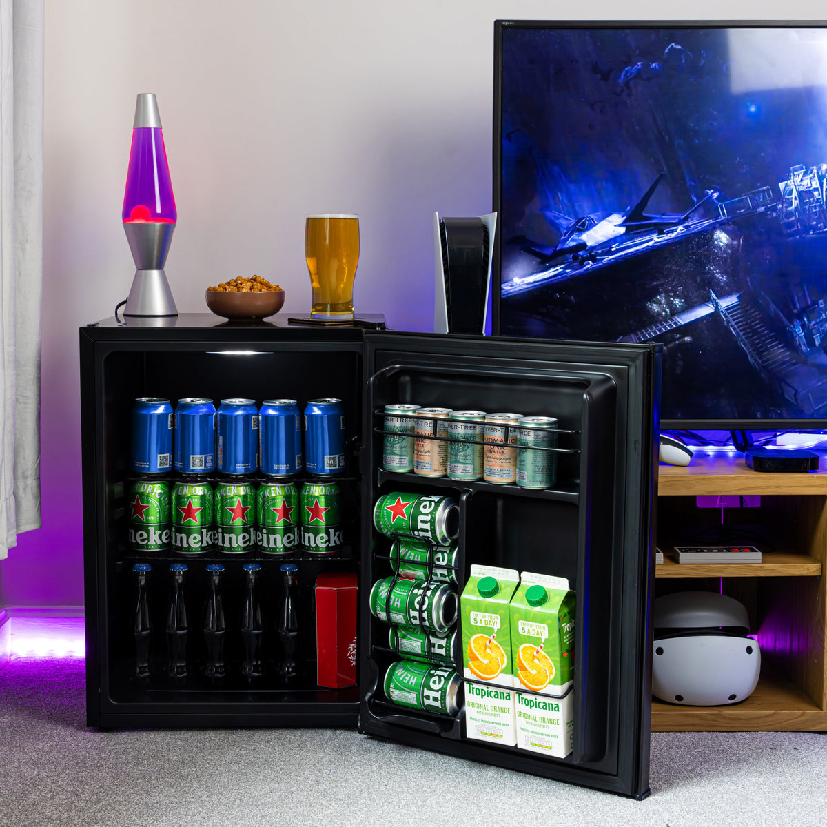 Black beer fridge with open door, stocked with bottles and cans inside