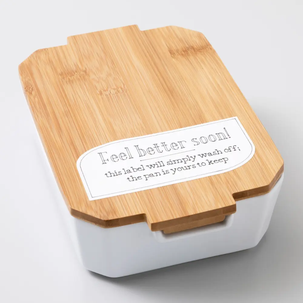 Dissolvable Smart LabelTM paper label on white container with wooden lid