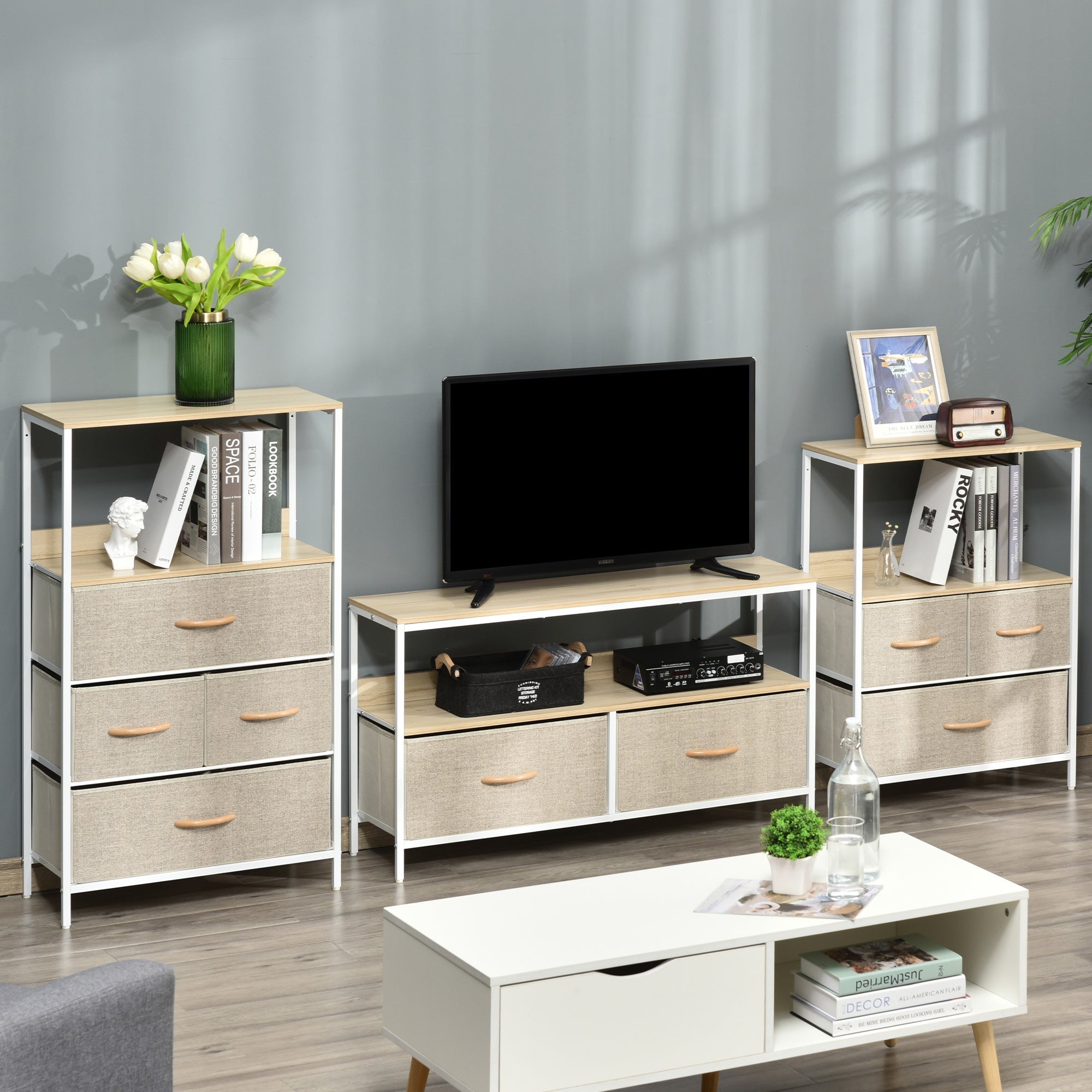 TV stand with open shelf and two gray linen drawers, light wood top, white frame in living room