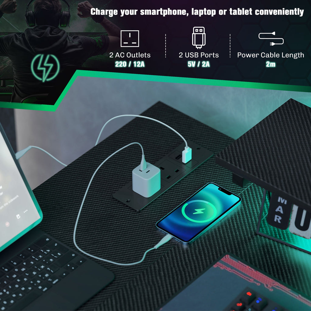 Black desk tabletop with USB and power ports plus charging cables and devices.