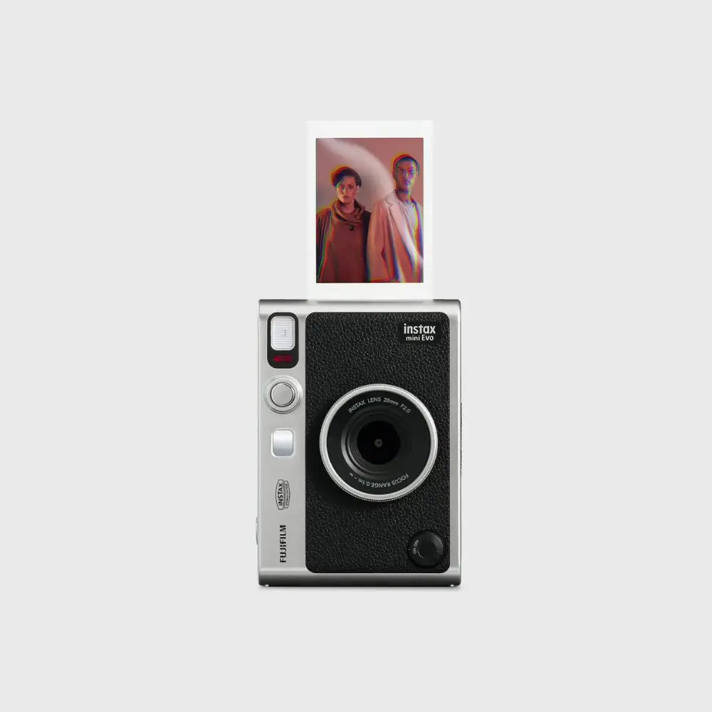 Hybrid instant camera front view, black textured finish, silver controls, and photo print