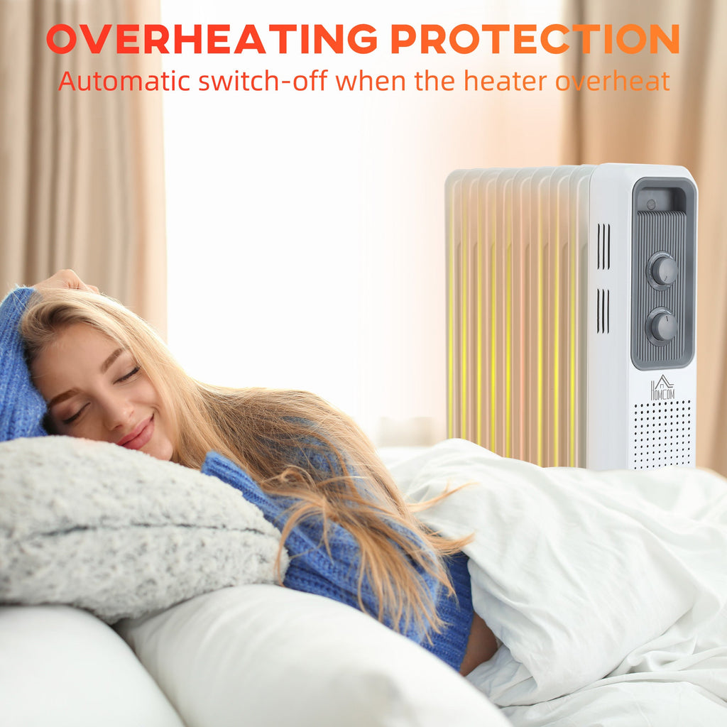 White oil-filled radiator heater with overheating protection, placed beside a sleeping person