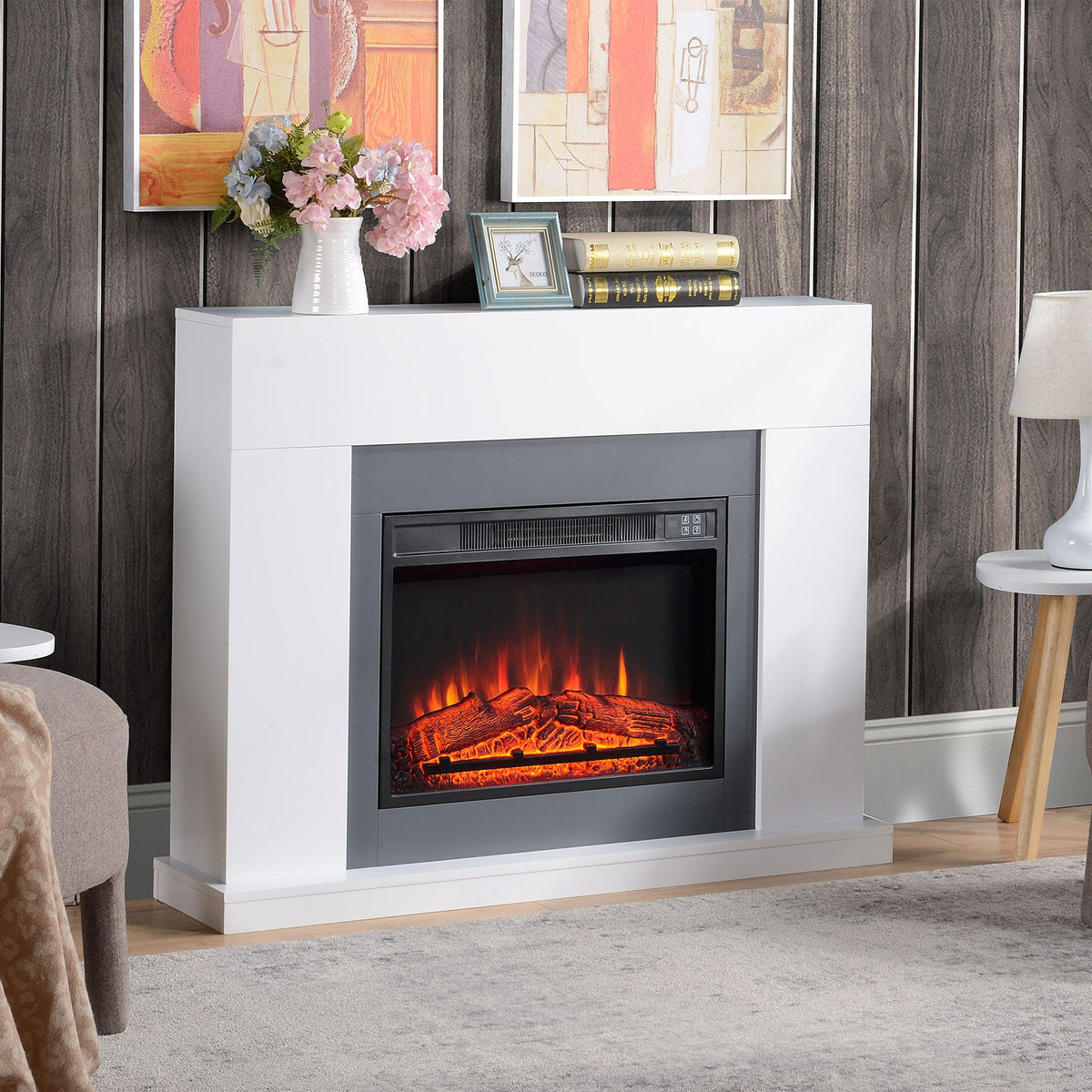 White freestanding electric fireplace suite with LED flame effect and dark inner panel