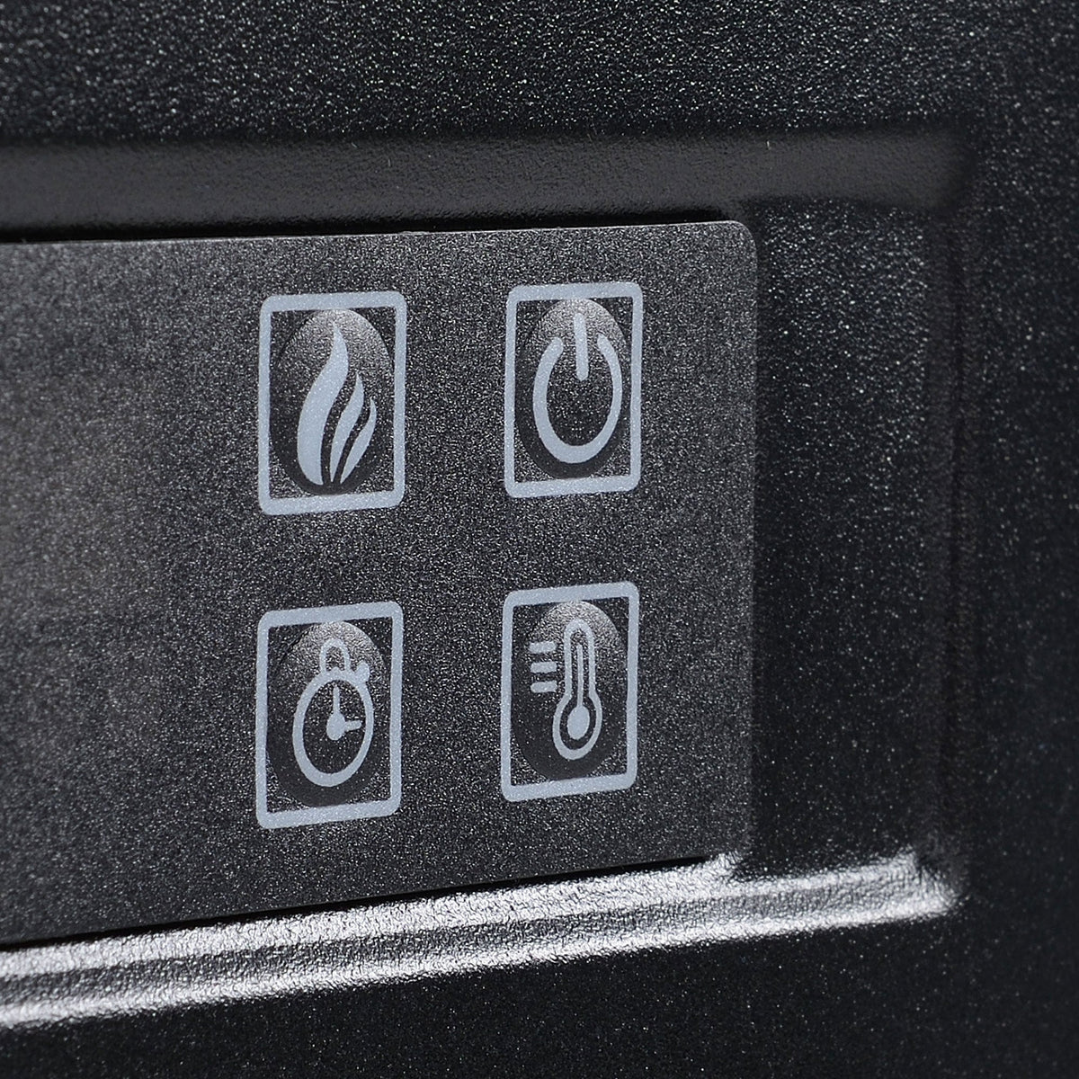 Close-up of electric fireplace control buttons with icons for flame and temperature