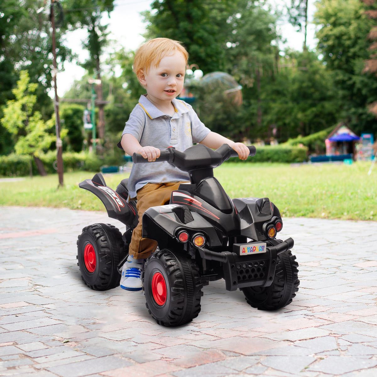 Black kids electric quad bike with four rugged tires, front headlights, and handlebar